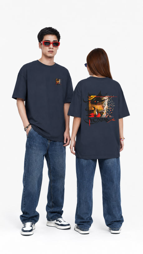 HUGFAB unisex charcoal oversized graphic t-shirt with front mini print and bold abstract back design, styled with blue jeans for streetwear fashion