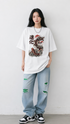 HUGFAB Dragon Koi white oversized graphic T-shirt worn by female model with baggy jeans and sneakers