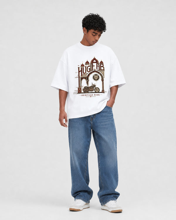 HUGFAB Heritage Ride white oversized graphic T-shirt worn by male model with baggy blue jeans