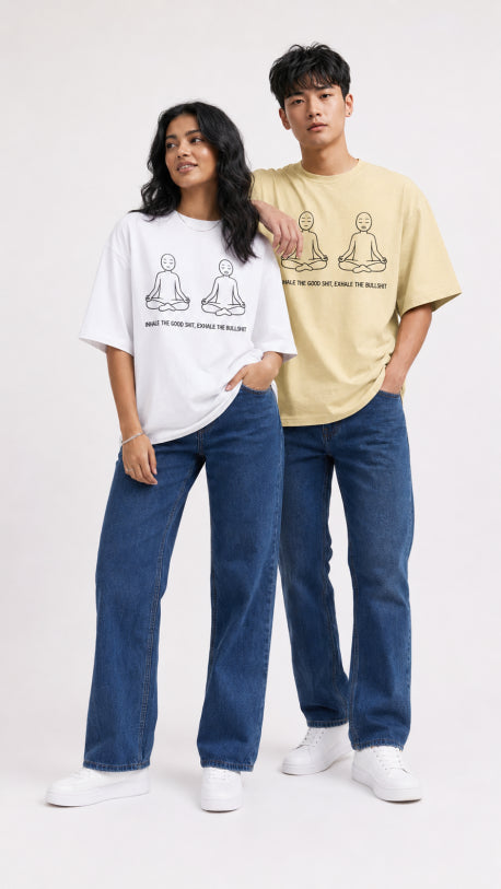 Models wearing HUGFAB meditation graphic oversized T-shirts with blue jeans on white background
