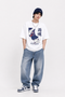 HUGFAB Rain Spirit white oversized graphic T-shirt worn by male model with baggy jeans and navy beanie