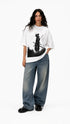 HUGFAB white oversized T-shirt with black samurai graphic print styled with baggy jeans on a model