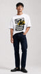 Model wearing HUGFAB white normal roads graphic oversized T-shirt with dark jeans on white background