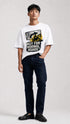 Model wearing HUGFAB white normal roads graphic oversized T-shirt with dark jeans on white background