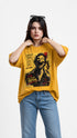 Model wearing HUGFAB yellow graphic oversized T-shirt with blue jeans on white background